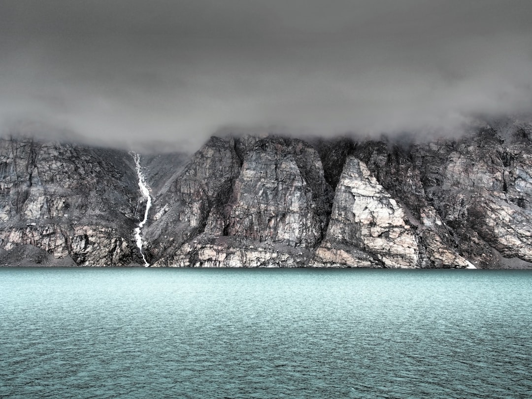 Misty Arctic Waterfall Wallpaper